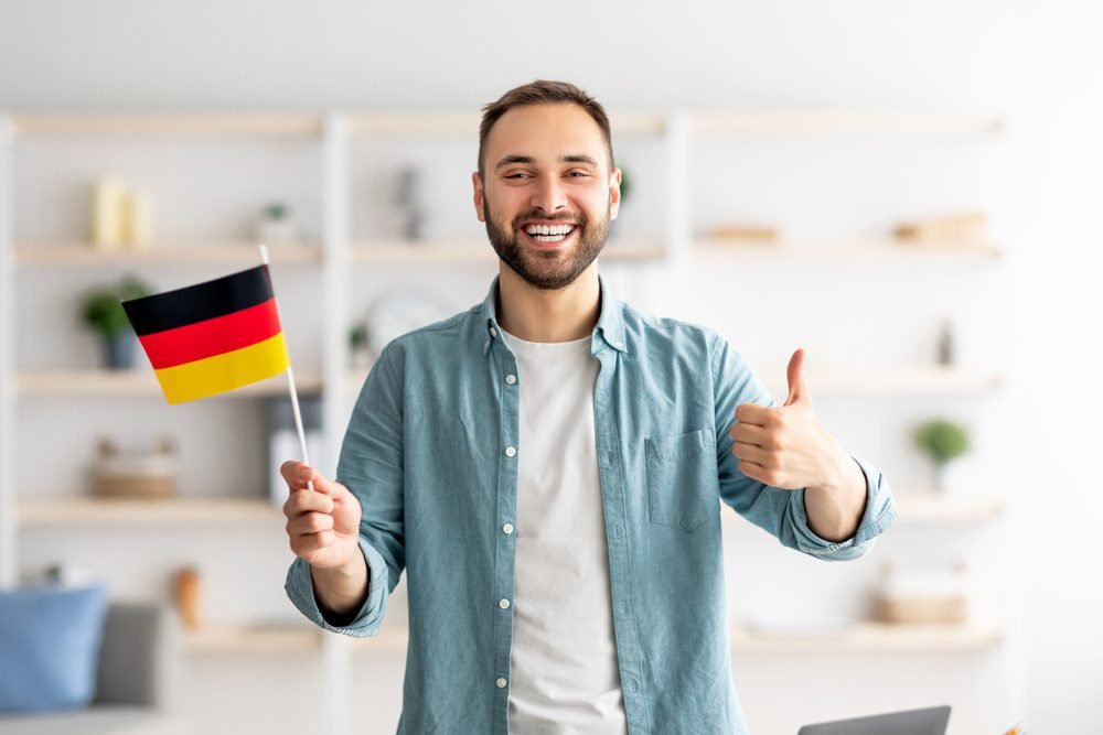 man holding a german flag